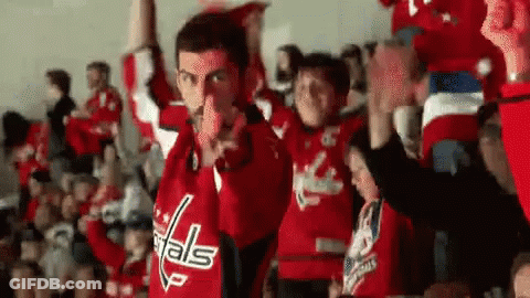 Man In Capitals Jersey Pointing At Cheering Crowd GIF