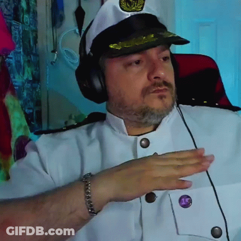 Man In Captain Hat And Headphones With Purple Button Saying 15 GIF