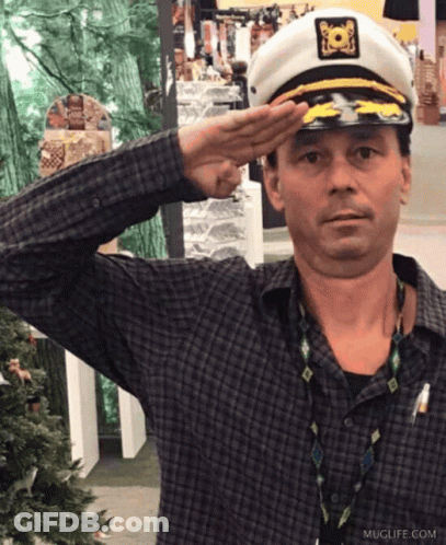 Man In Captain Hat Saluting Muglife.com GIF