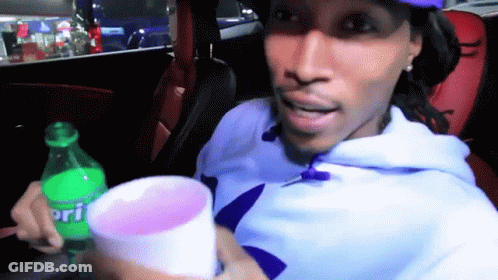 Man In Car Holding Sprite Bottle And Cup GIF