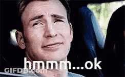 Man In Car Making Funny Face Hmm... Ok GIF