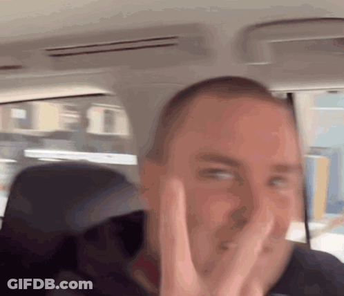 Man In Car Making Peace Sign GIF