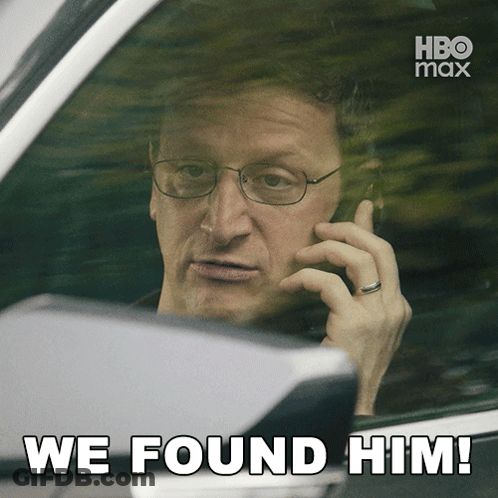 Man In Car On Phone Saying We Found Him GIF