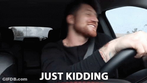 Man In Car Saying Just Kidding GIF