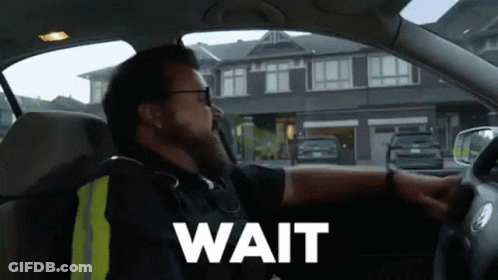 Man In Car Saying Wait GIF