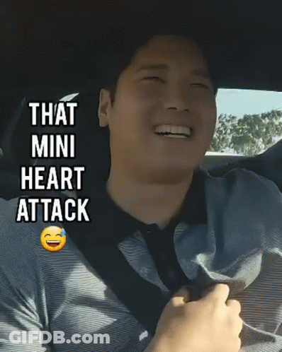 Man In Car Smiling Saying Mini Heart Attack GIF