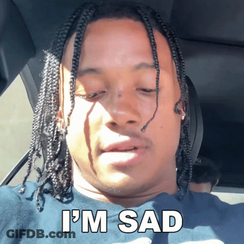Man In Car With I'm Sad On Shirt GIF