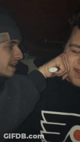 Man In Carhartt Hat Holding Face GIF