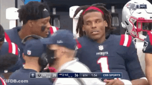 Man In Carolina Panthers Jersey Next To Man In White Shirt GIF