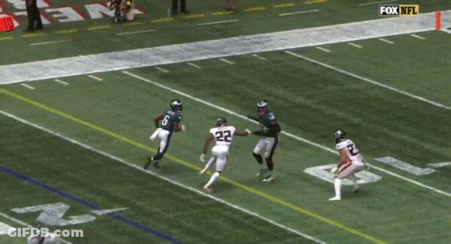 Man In Carolina Panthers Uniform Smoking Cigarette GIF