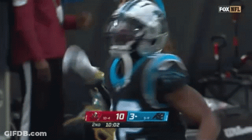 Man In Carolina Panthers Uniform Smoking Cigarette GIF