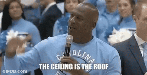 Man In Carolina Shirt Holding Microphone To Crowd GIF