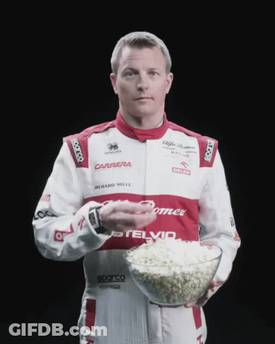Man In Carrera Uniform Holding Bowl Of Popcorn GIF