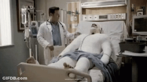 Man In Cast Laying In Hospital Bed With Doctor GIF