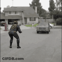 Man In Cat Costume Dancing In Front Of House And Car GIF