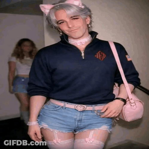Man In Cat Ear Headband And Shorts With Pink Bag GIF