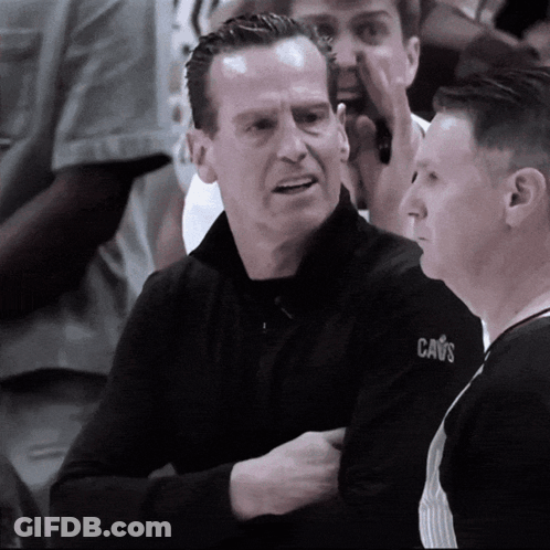 Man In Cavs Jacket Talking To Referee GIF