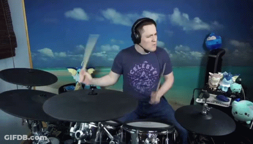 Man In Celeste Shirt Playing Drums GIF