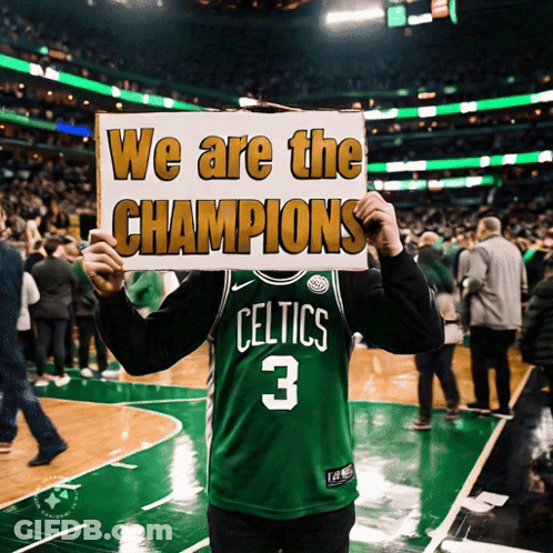 Man In Celtics Jersey Holding Sign Saying We Are The Champions GIF
