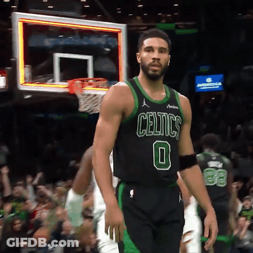 Man In Celtics Jersey Standing In Front Of Basketball Net GIF