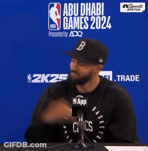 Man In Celtics Shirt Talks Into Microphone At Abu Dhabi Games 2024 GIF