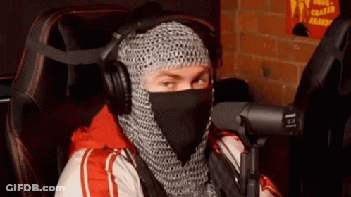 Man In Chain Mail At Microphone With Headphones GIF