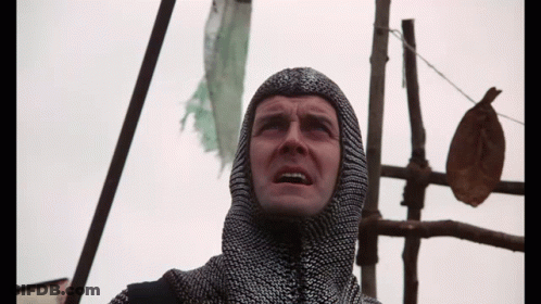Man In Chain Mail Hood Looking Up GIF