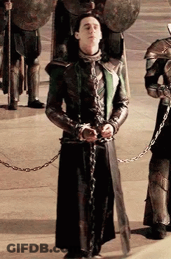 Man In Chains Before Soldiers With Shields GIF