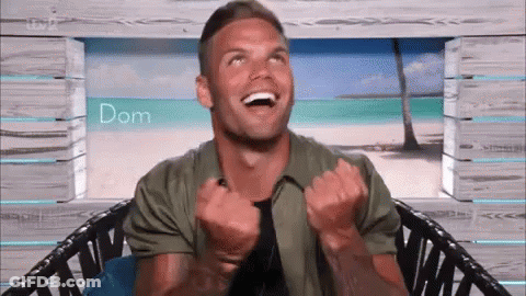 Man In Chair Laughing Arms Up GIF