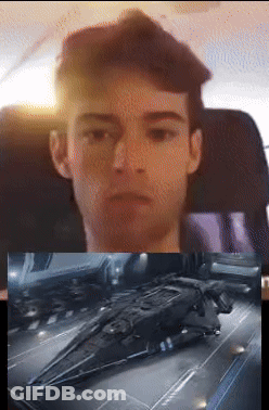 Man In Chair Next To Spaceship Picture GIF