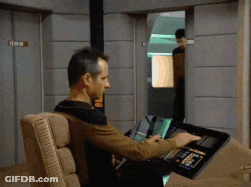 Man In Chair Using Device Saying Command GIF