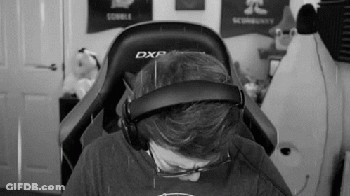 Man In Chair With Headphones And Glasses GIF