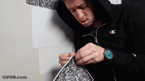 Man In Champion Hoodie Working On Art GIF