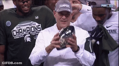 Man In Champions Hat Holding Football GIF