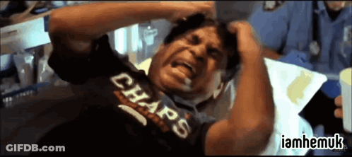 Man In Chaps Shirt Laying In Hospital Bed With Hands On Head GIF