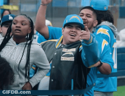 Man In Chargers Jacket Pointing GIF