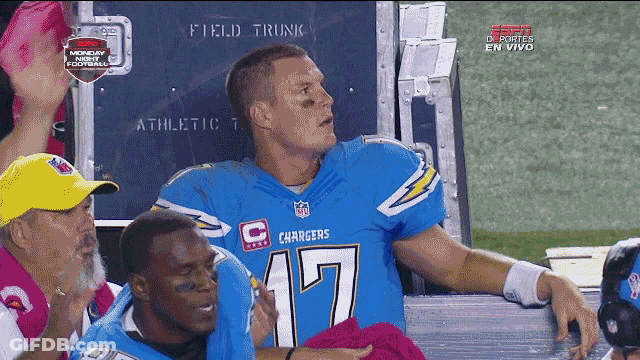 Man In Chargers Jersey Sitting On Bench GIF
