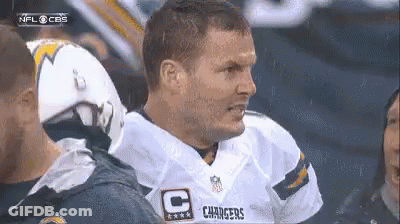 Man In Chargers Jersey Talking To Man In Helmet GIF