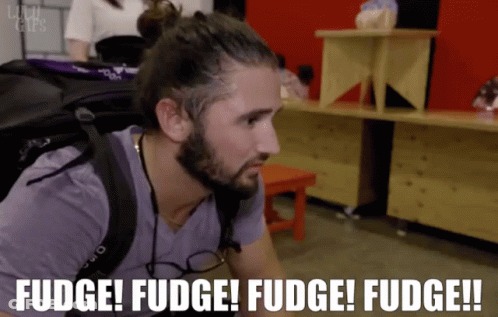 Man In Checkered Shirt Near Netflix Logo GIF