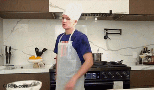 Man In Chef Hat And Apron In Kitchen GIF