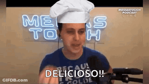Man In Chef Hat Saying Delicious At Microphone GIF