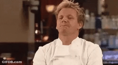 Man In Chef's Uniform Making Funny Face At Bar GIF