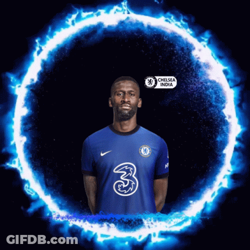 Man In Chelsea India Jersey In Front Of Blue Circle Of Fire GIF