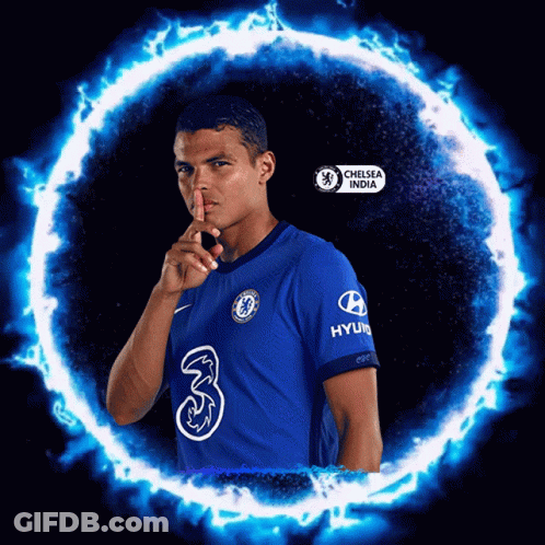 Man In Chelsea India Shirt Holding Finger To Lips GIF