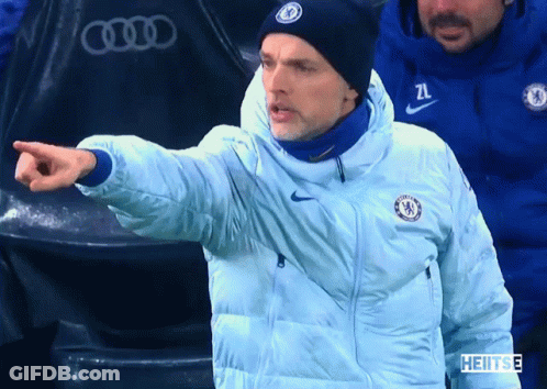 Man In Chelsea Jacket And Beanie Pointing GIF