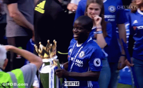 Man In Chelsea Jersey Holding Trophy In Front Of Crowd GIF