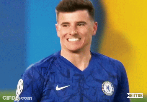 Man In Chelsea Jersey Smiling At Camera GIF