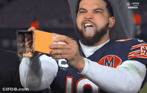 Man In Chicago Bears Jersey Holding Box Of Cheese GIF