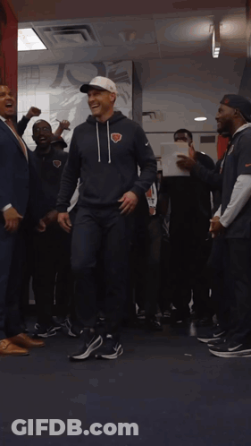 Man In Chicago Bears Sweatshirt In Locker Room GIF