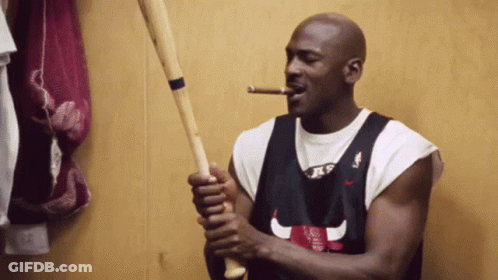 Man In Chicago Bulls Jersey Smoking Cigar Holding Baseball Bat GIF